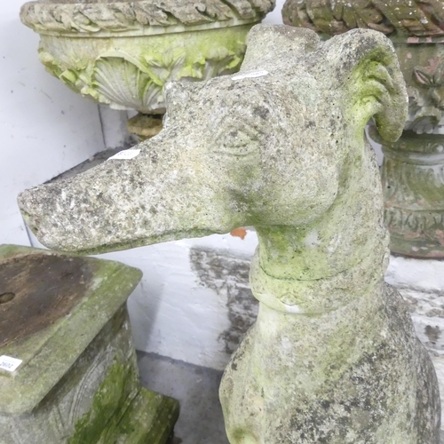 2604 - A weathered concrete statue of a hound. Height 95cm.