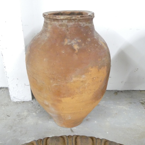 2606 - A terracotta olive jar. Height 48cm.