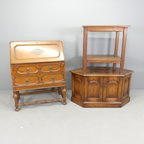 2617 - An early 20th century panelled oak Bureau, A/F, 75x100x44cm, an oak TV stand and a two-tier oak side... 