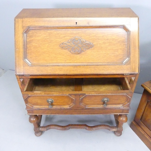 2617 - An early 20th century panelled oak Bureau, A/F, 75x100x44cm, an oak TV stand and a two-tier oak side... 