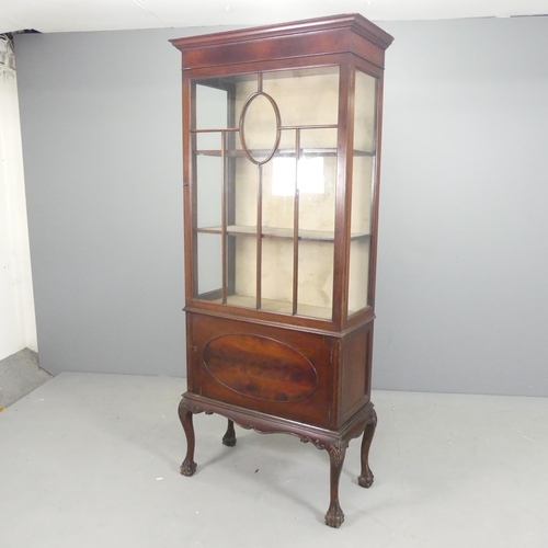 2620 - A reproduction Victorian style mahogany display cabinet, with lattice glazed door and two shelves ab... 