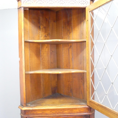 2623 - A Georgian style panelled oak two-section corner cupboard. 73x191x40cm.