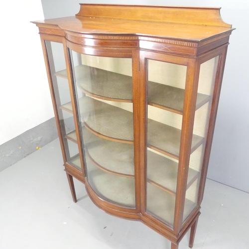 2625 - An Edwardian mahogany and satinwood strung bow-front display cabinet, with single glazed door, three... 