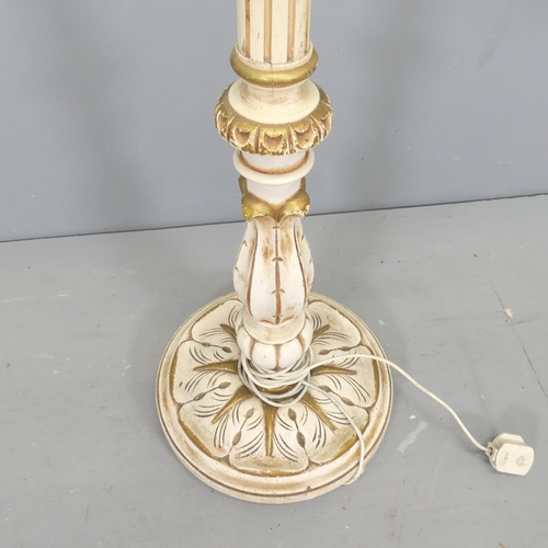 2629 - A painted continental style standard lamp, with carved and fluted decoration.