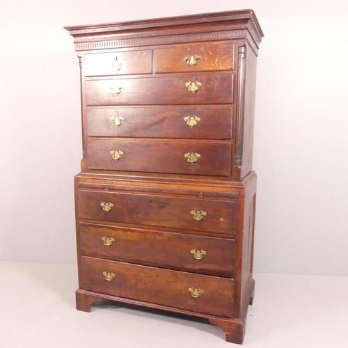 2630 - A Georgian oak two-section chest-on-chest of two short and six long drawers, with brushing slide, ca... 