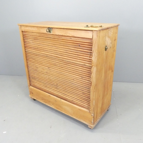 2631 - A vintage pine tambour fronted filing cabinet. 88x42x90cm