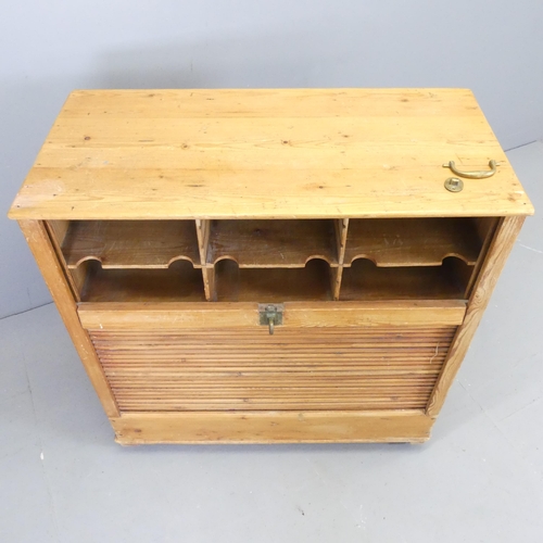 2631 - A vintage pine tambour fronted filing cabinet. 88x42x90cm