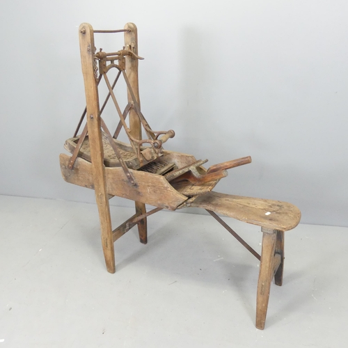 2637 - An antique oak wool carding machine. 115x120x36cm.