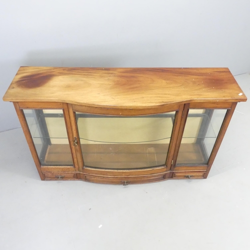 2640 - A 19th mahogany bow-front display cabinet with single door, single fixed shelf and three drawers und... 