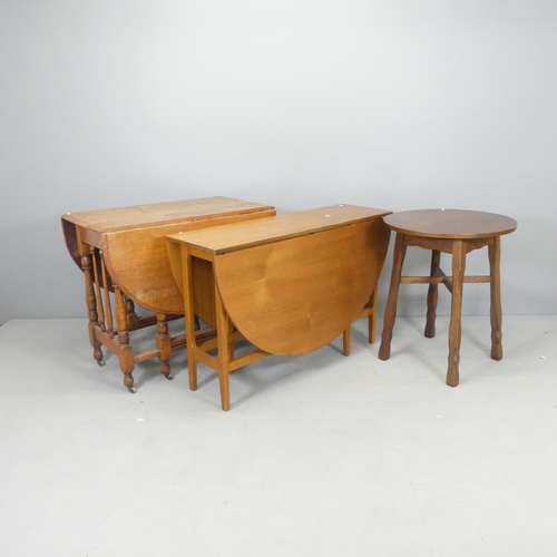 2643 - A modern oak circular occasional table in the manner of Heals, 61x71cm, and a mid-century teak drop-... 