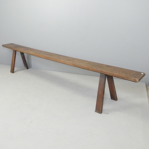 2651 - A 19th century oak bench with A frame legs. 274x50x35cm.