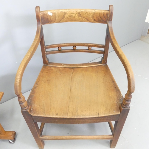 2652 - A Georgian oak desk chair with panelled seat, and an oak side table. (2)