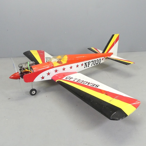 2653 - A remote controlled Seagull 40 trainer aeroplane. A/F. No control present. Wingspan 142cm, length 12... 