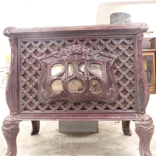 2660 - A French cast iron wood burning stove. Overall 56x52x34cm.