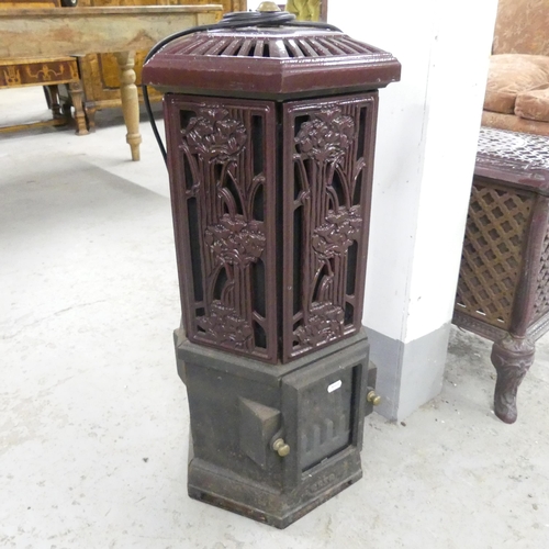 2661 - A modern electric heater in the form of an antique station hexagonal heater. Marked esse. 35x75cm.