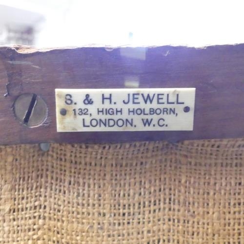 2664 - A 19th century mahogany bergere lounge chair, with label to underside for S. & H. Jewell, London. Ca... 