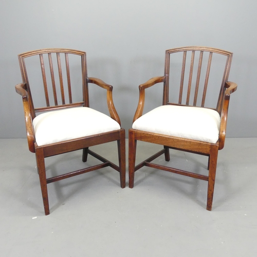 2666 - A pair of Georgian style mahogany open arm chairs, with upholstered drop-in seats.