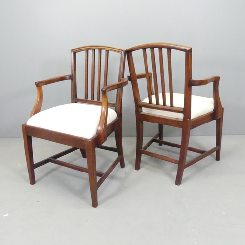 2666 - A pair of Georgian style mahogany open arm chairs, with upholstered drop-in seats.