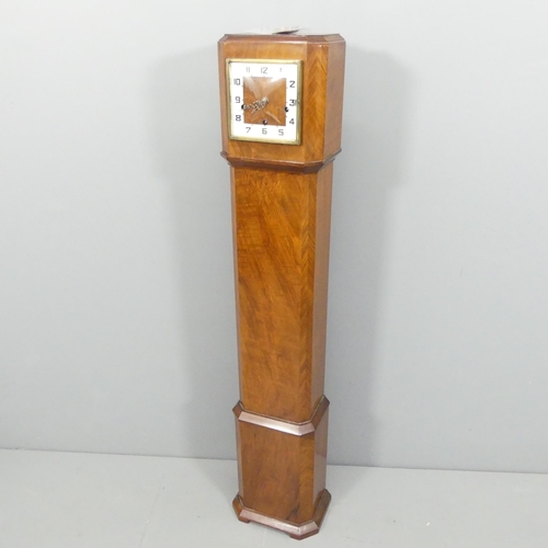 2673 - A walnut cased grandmother clock, with key and pendulum. 24x130x17cm.