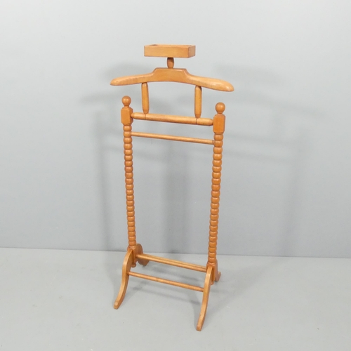 2679 - A stained beech dumb-valet stand. 54x120x25cm.