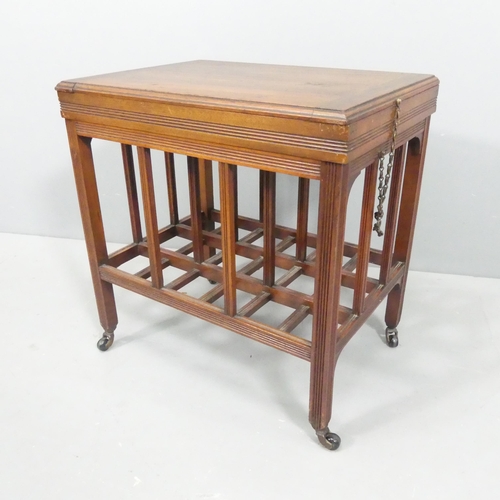 2232 - A late Victorian Aesthetic movement low table in the manner of E. W. Godwin, the hinged top enclosin... 