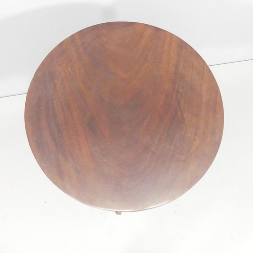 2235 - An antique mahogany circular tilt-top occasional table. 54x72cm.