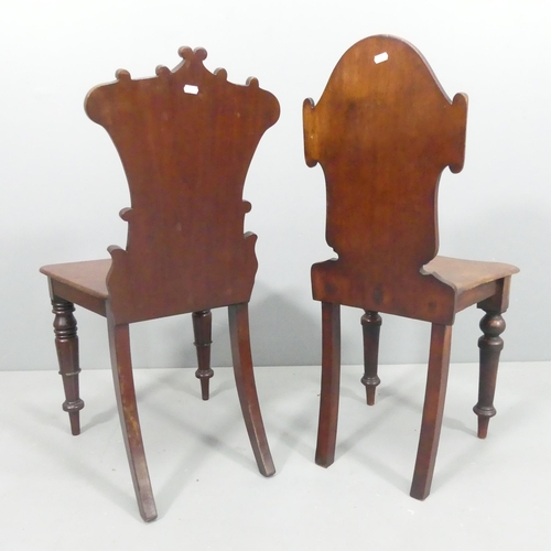 2237 - Two similar Victorian mahogany shield-back hall chairs.