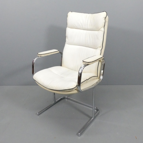 2240 - A mid-century style faux-leather upholstered lounge chair on tubular steel frame.