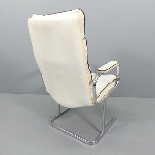 2240 - A mid-century style faux-leather upholstered lounge chair on tubular steel frame.