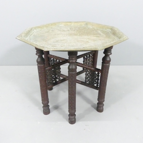 2243 - An Anglo-Indian octagonal brass tray top table on folding base. 57x48cm.