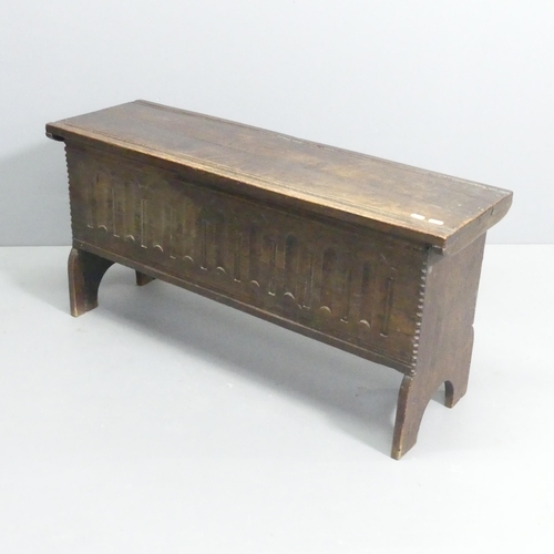 2245 - An antique oak blanket box, with carved decoration and raised on stole legs. 98x48x31cm