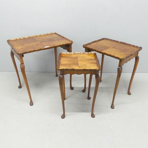 2683 - A nest of three walnut rectangular occasional table, largest  53x56x40cm