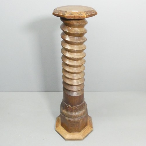 2050 - A large antique French elm spiral turned column with carved oak octagonal top, skirt and base. Carve... 