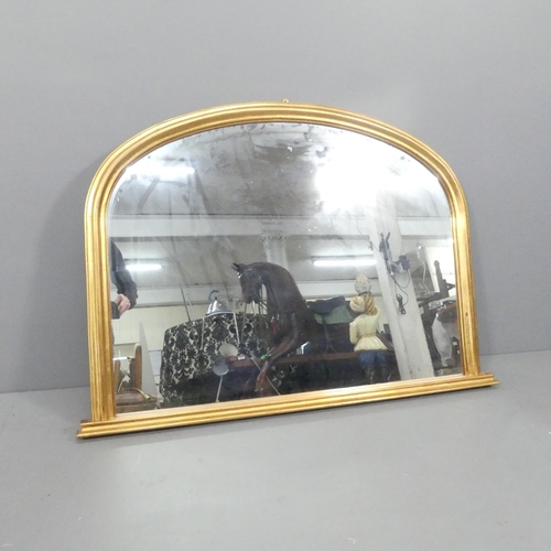 2247 - A modern arch-top overmantle mirror, with label for John Lewis. 114x82cm,