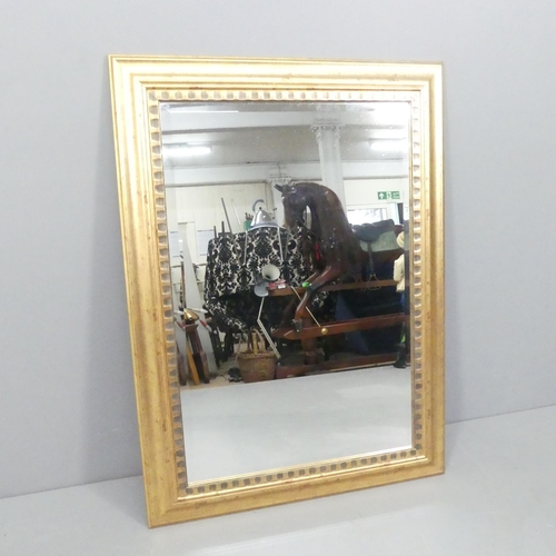 2248 - A modern resin cushion framed wall mirror. 79x108cm.