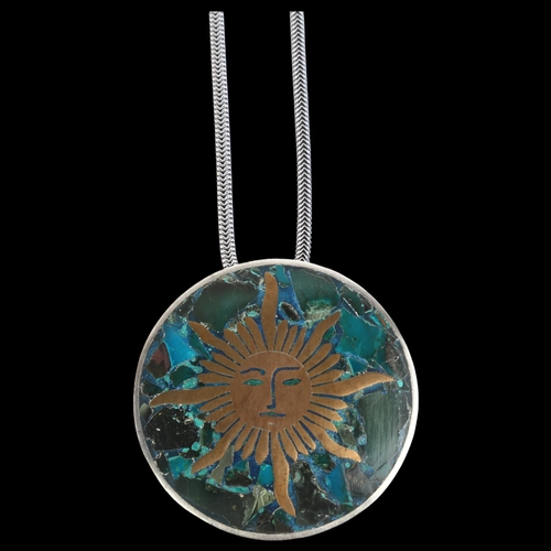 907 - ANTONIO TAXCO - a large Mexican brass and composite stone inlaid sterling silver sun pendant necklac... 