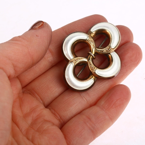 913 - A Norwegian sterling silver-gilt white enamel openwork brooch, maker JA, 41.1mm, 8.3g