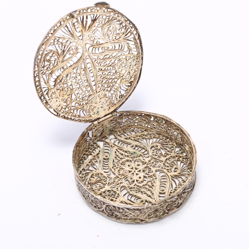 922 - An Indian silver filigree floral box, circular form, 6cm