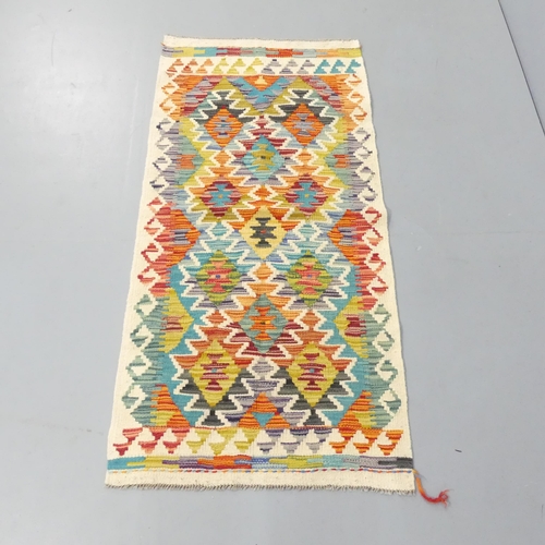 2268 - A Chobi Kilim runner. 140x66cm.