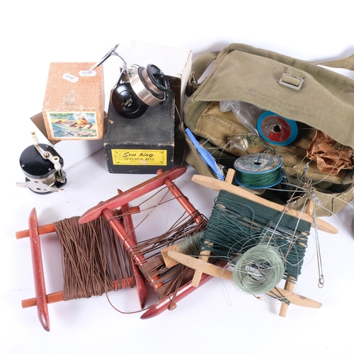 A group of vintage fishing reels and associated items, including