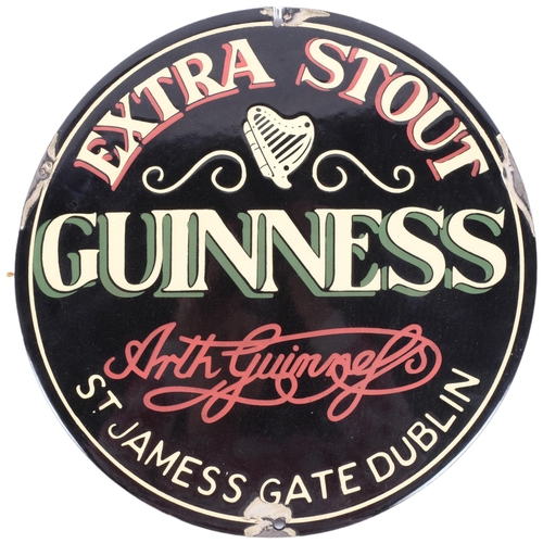 104 - A reproduction enamel Guinness advertising sign, 29cm