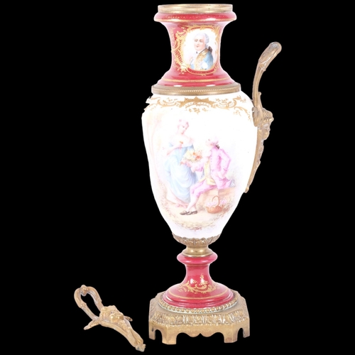 110 - A brass and ormolu mounted 2-handled ceramic urn, with hand painted and gilt decoration. H - 36cm.