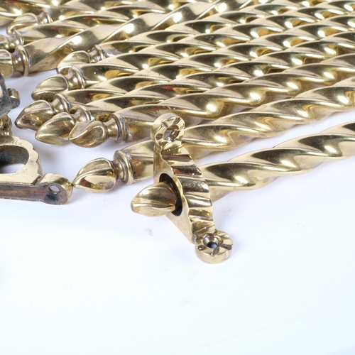 112 - A collection of 18 brass spiralled stair rods and associated clips. All are same length, 79cm.