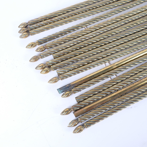 113 - A quantity of spiralled brass stair rods. 10 rods have both associated finials, 3 with only a single... 