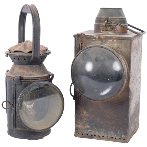 117 - A large unmarked metal bullseye lantern. H - 32cm. And a vintage railway lantern, complete with burn... 