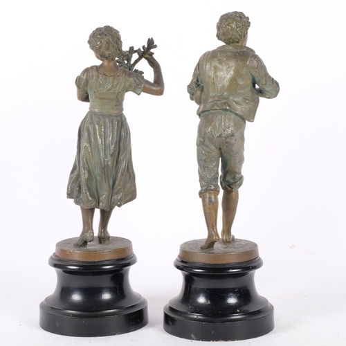 121 - A pair of spelter figures on hardwood stands. One of a young male musician (H-31cm), the other a gir... 