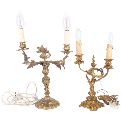 140 - 2 similar gilt-brass rococo 2-branch table candelabra. Largest - 56cm. Both converted.