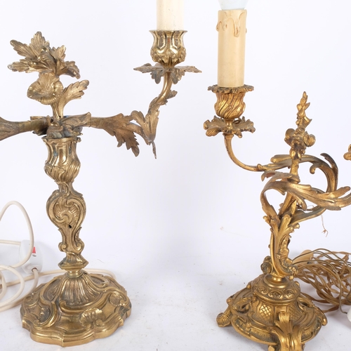 140 - 2 similar gilt-brass rococo 2-branch table candelabra. Largest - 56cm. Both converted.