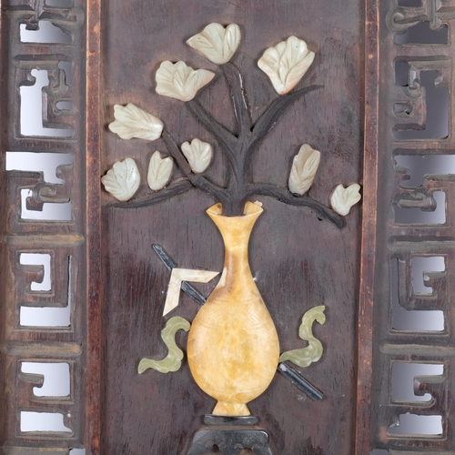 148 - A Chinese hardwood plaque with pierced and floral stone decoration. 82x37cm.