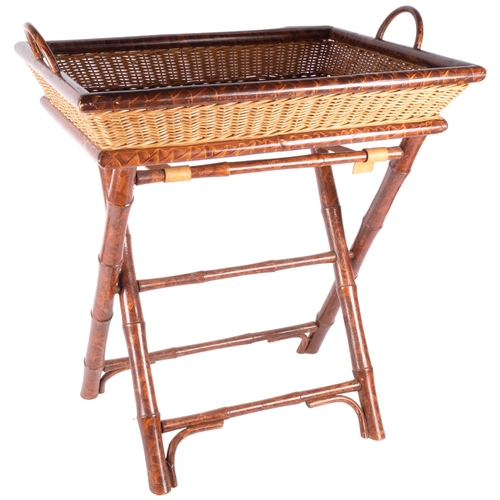 151 - A wicker and faux bamboo tray on folding stand. H - 72cm, L - 61cm, D - 46cm.